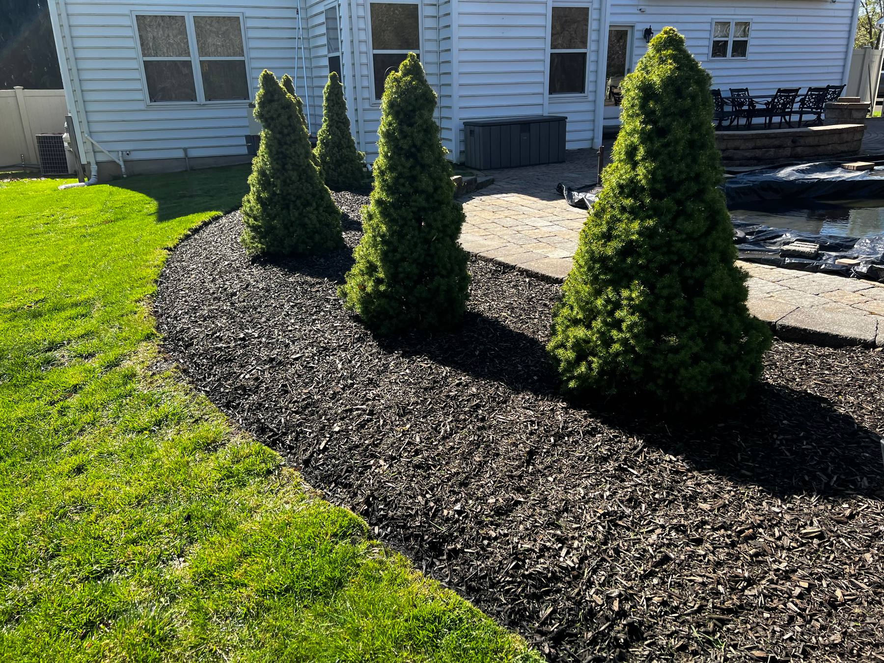 Front bed cleanup and mulch work for an Upper Bucks property