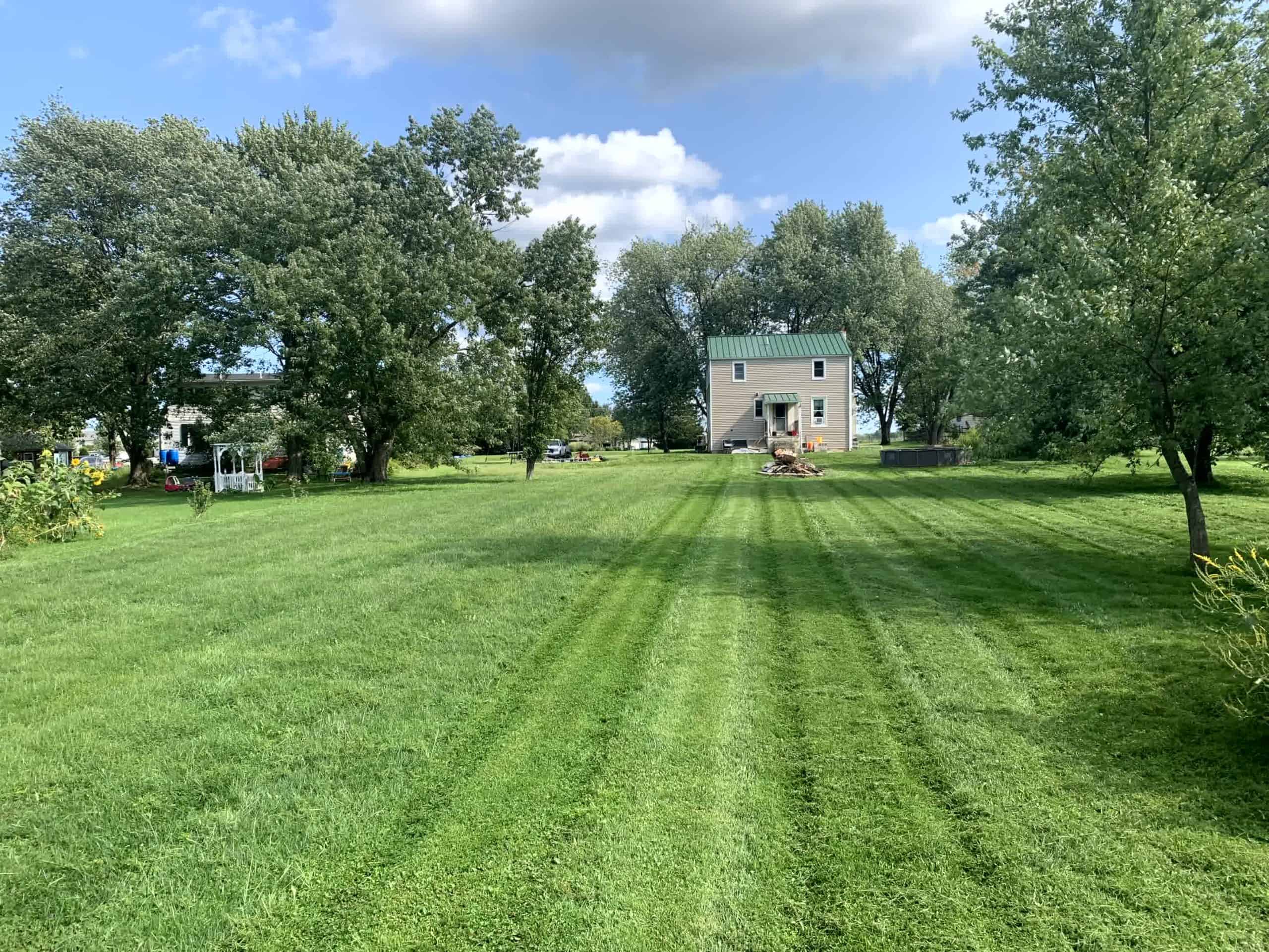 aVibrant green and flat lawn from aeration.